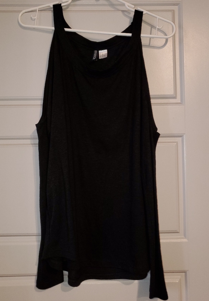 Black long sleeve shoulder showing shirt.